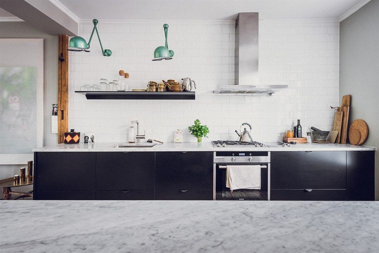 Black kitchen with marble countertop